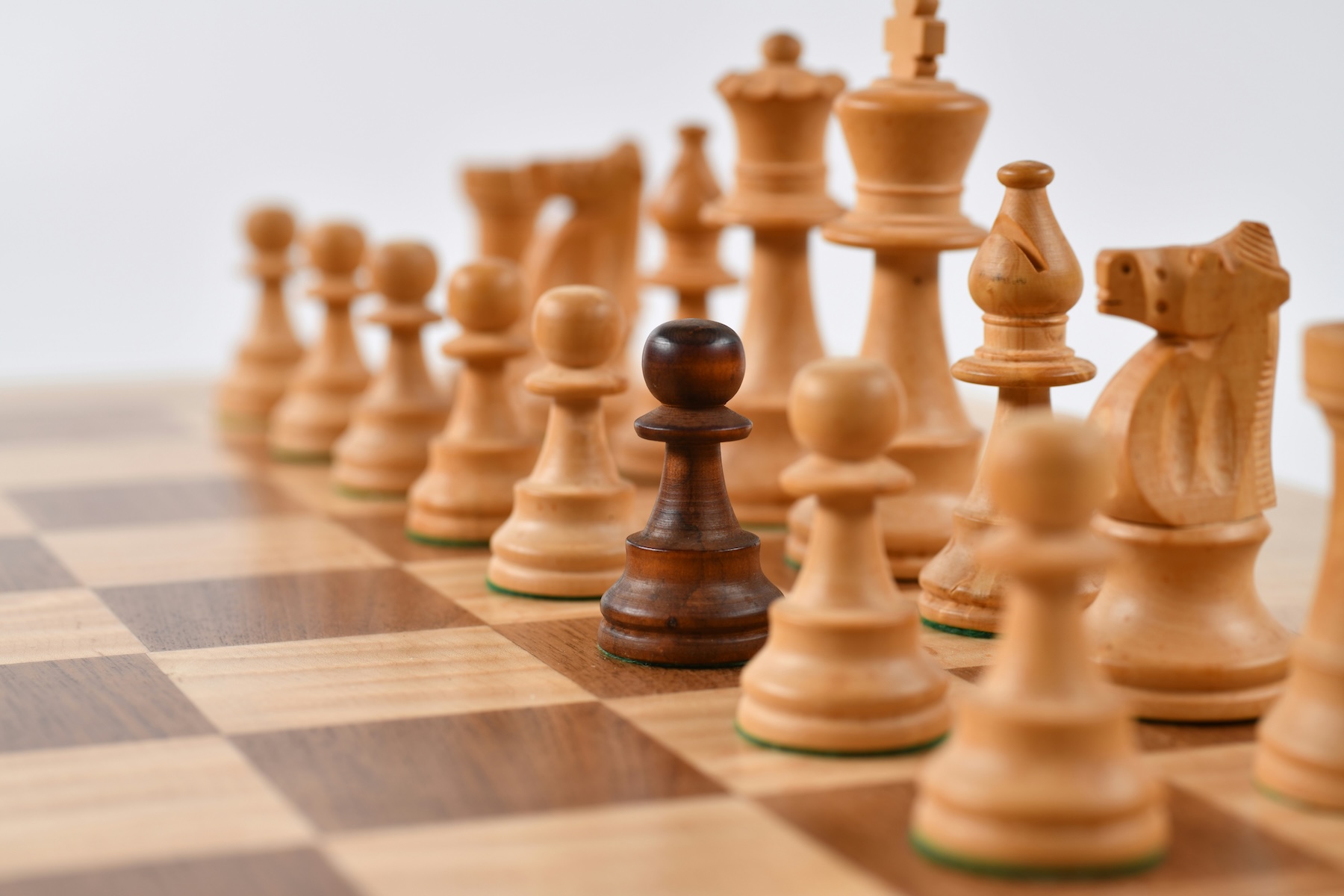 Selective focus photography of chess pieces, representing strategic area code selection for business