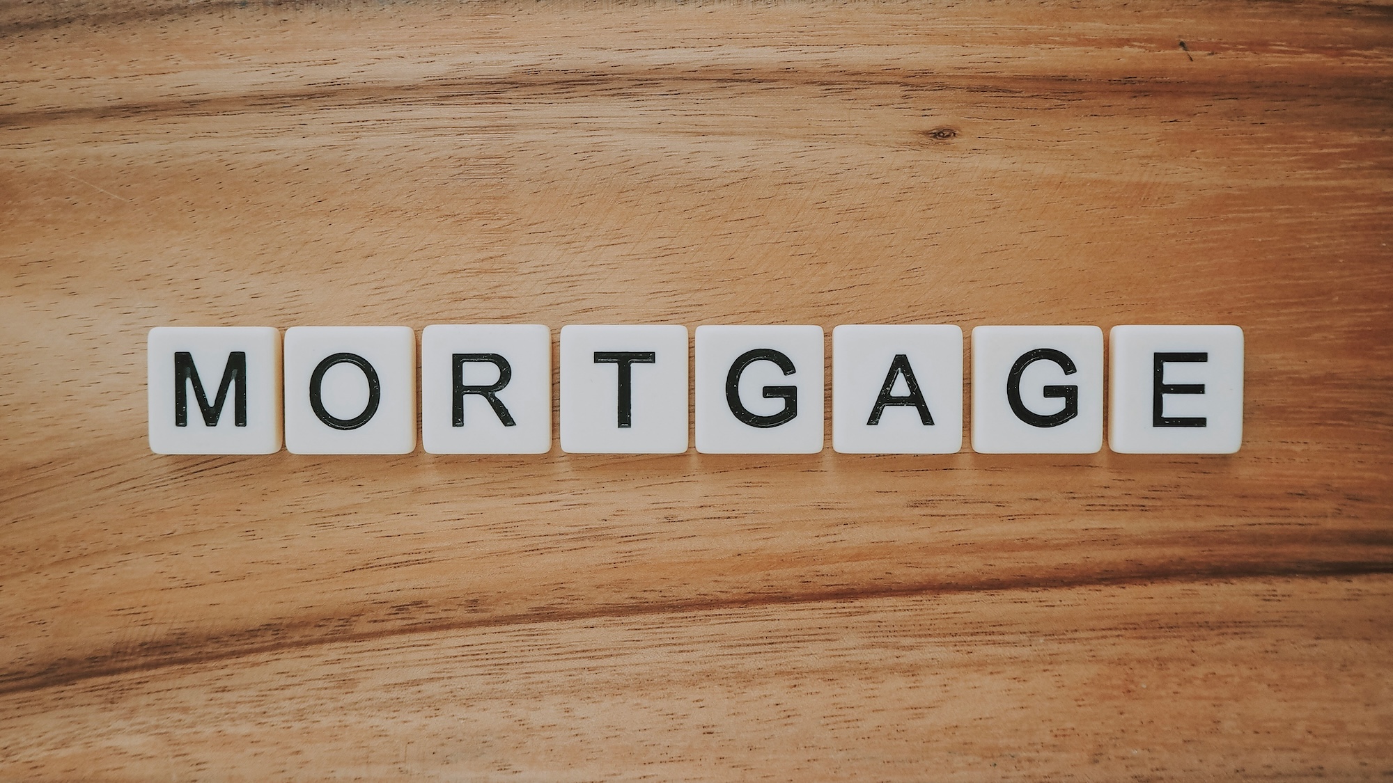 Mortgage spelled out in Scrabble tiles, representing the mortgage broker industry